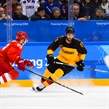 GANGNEUNG, SOUTH KOREA - FEBRUARY 25: Olympic Athletes from Russia's Nikita Nesterov #89 and Germany's Matthias Plachta #22 chase down a loose puck during gold medal round action at the PyeongChang 2018 Olympic Winter Games. (Photo by Andrea Cardin/HHOF-IIHF Images)

